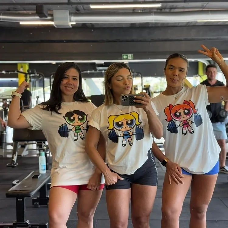 Power Pup Cartoon Tee — Cute Girl Lifting Weights Graphic Shirt